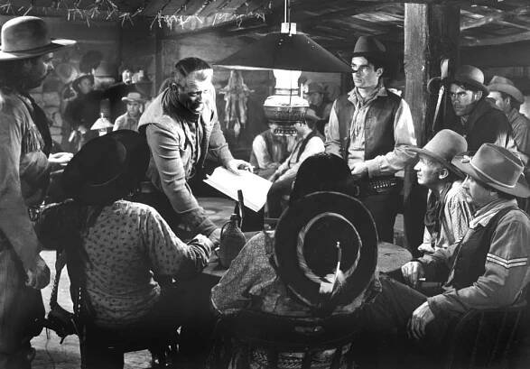 RED RIVER, from left: Dan White, Noah Beery Jr, John Wayne, Chief Yowlachie, Montgomery Clift, Walter Brennan, Ivan Parry, Paul Fix, 1948