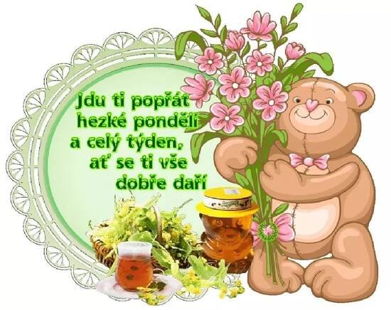 a teddy bear holding flowers next to a jar of honey