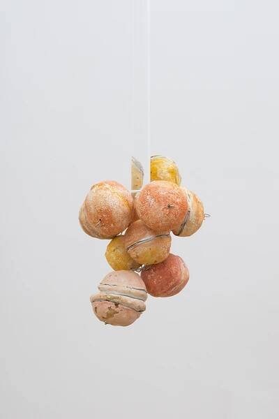 Untitled (Citrus Balls 3) Solid cast acrylic rod, various citrus fruit rinds, epoxy putty, oil pastel, stainless steel wire, and enamel; dimensions variable; 2018