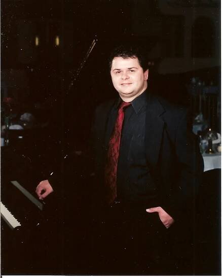 John O'Keefe Picture by the Grand Piano