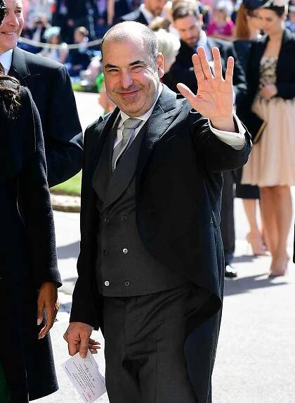 Rick Hoffman waving to the cameras while arriving at St. Georgeâs Chapel at Prince Harry and Meghan Markleâs wedding