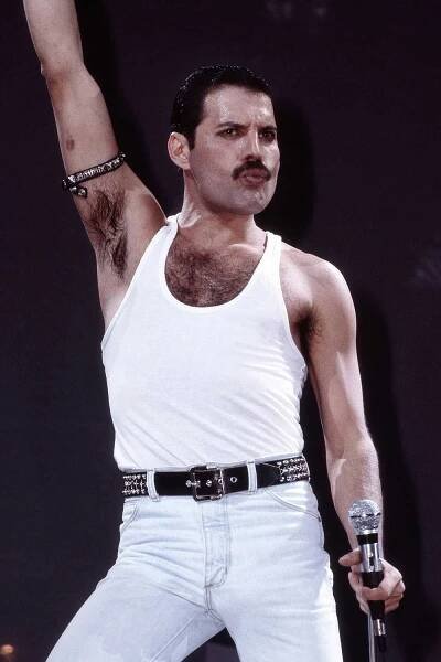 Freddie Mercury of Queen performs on stage at Live Aid at Wembley Stadium on 13th July 1985 in London. 