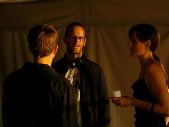 Joachim Trier alongside Anders Danielsen Lie (left) and Renate Reinsve (right) on the set of "The Worst Person in the World."