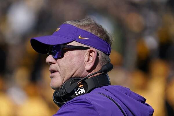 Head coach Brian Kelly of the LSU Tigers stands watches his team during a game against the Missouri Tigers.