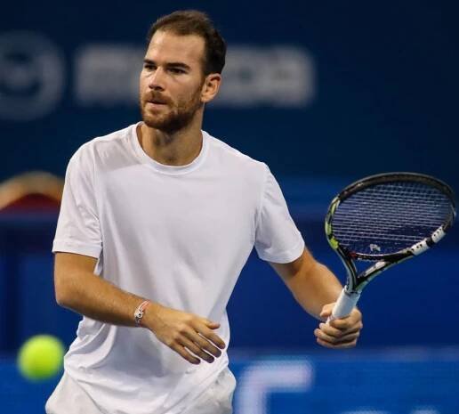 Adrian Mannarino in action at the Sofia Open Tennis Tournament Wallpaper