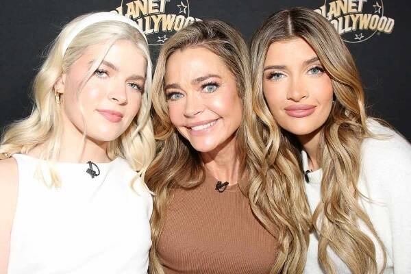 Lola Sheen, Denise Richards and Sami Sheen pose as they promote their new show "Denise Richards and Her Wild Things" at Planet Hollywood Times Square on February 26, 2025 in New York City. 