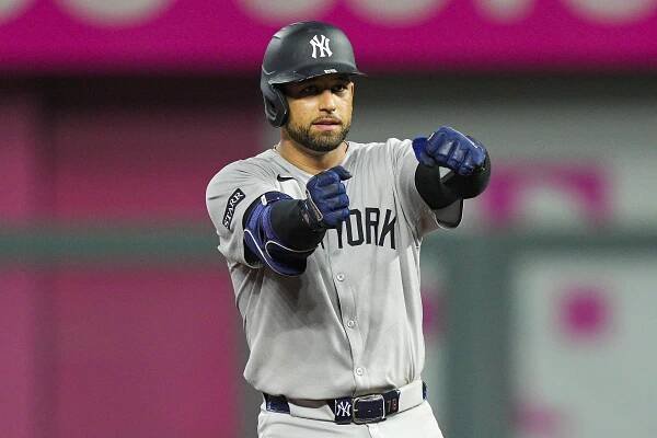 J.C. Escarra #25 of the New York Yankees gestures after hitting a double.