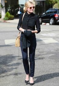 West Hollywood, CA - Actress Kirsten Dunst has a brief chat with photographers as she returns to her car with a friend after lunch at Il Piccolino in West Hollywood.