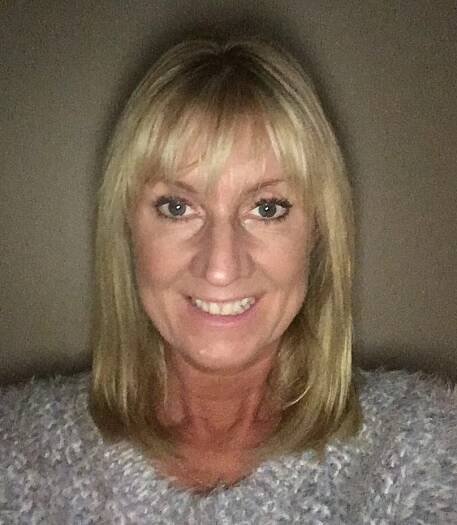 Alison Craddock - white woman with dyed blond shoulder-length hair and fringe wearing a fluffy off-white jumper.