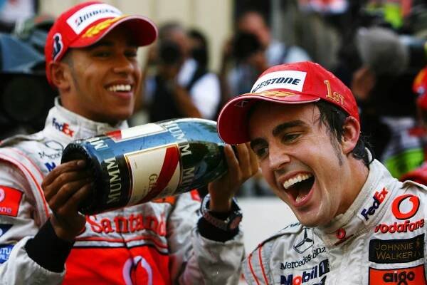 MONTE CARLO, MONACO - MAY 27:  Fernando Alonso (R) of Spain and McLaren Mercedes celebrates with