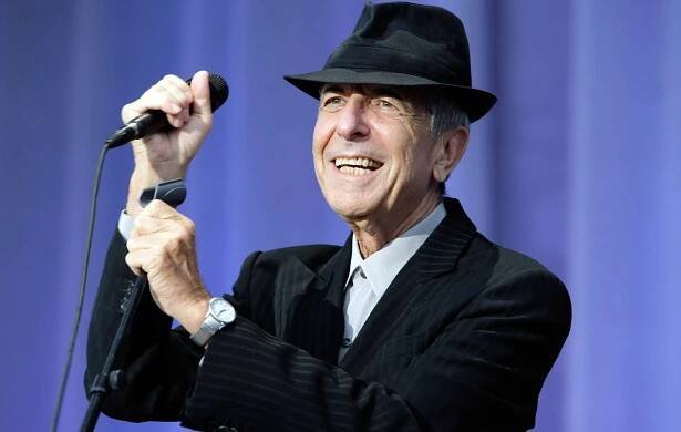 Leonard Cohen performs on stage at Mercedes-Benz World on July 11, 2009 in Weybridge, England. (Photo by Matt Kent/Redferns)