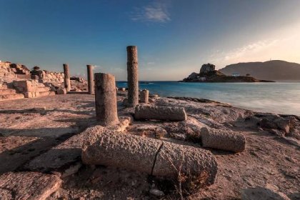 Ancient ruins at Agios Stefanos in Kefalos Bay in Kos, Islet of Kastri in the background, Kos, Dodecanese Greece