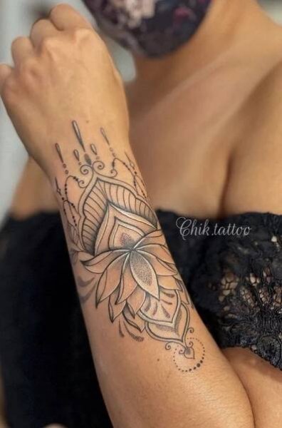 a woman with a tattoo on her arm