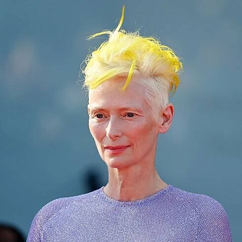Tilda Swinton’s Neon Yellow Hair In Venice Holds A Deeper Meaning