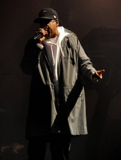  The rapper performed in a trench coat and hoodie