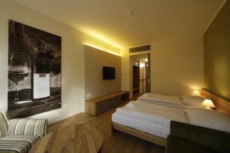 Postel nebo postele na pokoji v ubytování Hotel Madl