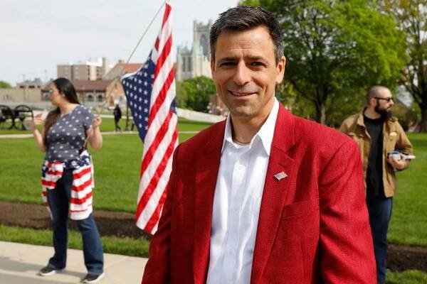 Ryan Kelley, Republication candidate for Michigan Governor, attends a protest against Governor Gretchen Whitmer outside the state Capitol in Lansing, Michigan on May 15, 2021.