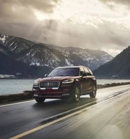 A 2025 Lincoln Aviator® is shown being driven along river valley