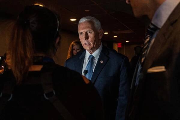 Former Vice President Mike Pence in a blue suit and tie.
