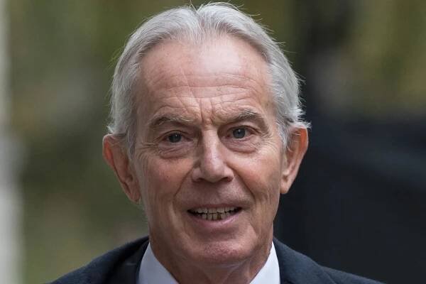 An image collage containing 1 images, Image 1 shows Portrait of Tony Blair wearing a poppy