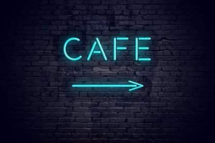 Cihlová zeď s neon šipku a znamení café — Stock obrázek
