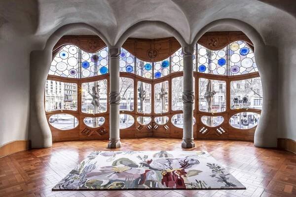 Nanimarquina's Flora Backyard natural-wool rug in a room with Art Nouveau columns and windows
