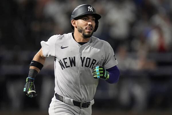 New York Yankees' José Caballero watches his two-run home run off Tampa Bay Rays pitcher Shane Baz during the second inning of a baseball game Tuesday, Aug. 19, 2025, in Tampa, Fla. 