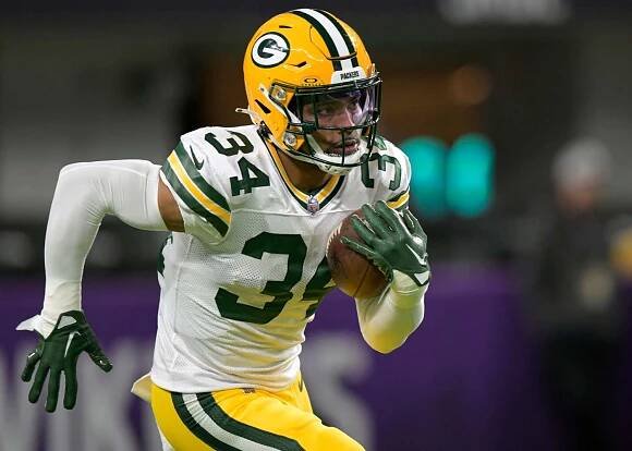 Green Bay Packers defensive back Jonathan Owens (34) warms up before an NFL game between the Minnesota Vikings and Green Bay Packers on December 31, 2023