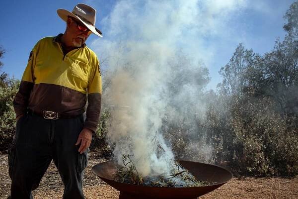   ‘Mungo Man’ for Smithsonian Magazine.  Aboriginal Discovery Ranger and Ngiyampaa man Lance Jones leads a traditional smoking ceremony with native Emu bush, Mungo National Park, Australia. 