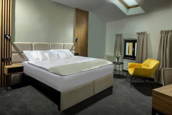 Ein Bett oder Betten in einem Zimmer der Unterkunft Hotel Savorsky
