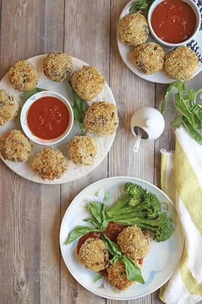 Overhead platters of arancini with marinara.