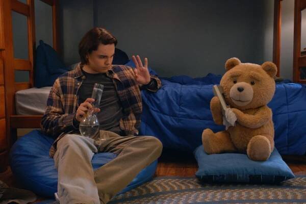 TED -- "My Two Dads" Episode 102 -- Pictured: (l-r) Max Burkholder as John, Seth McFarlane as voice of Ted (Photo by: PEACOCK)