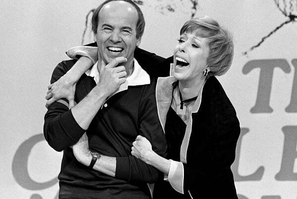 Comedian Carol Burnett laughs with co-star Tim Conway during the taping of the final episode of 