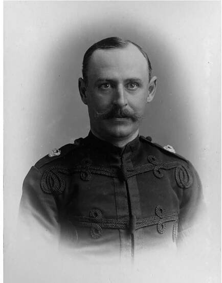 Fig. 4. E.J. Mostyn, Agent to the Arundel estate, in uniform as an officer in the 2nd Volunteer Battalion, Royal Sussex Regiment (Source: West Sussex Record Office, Royal Sussex Regiment Acc 3909).  B. Short, J. Godfrey | Journal of Historical Geography 33 (2007) 45—71  Outhwaite meanwhile busied himself during June 1909 attacking Lord Onslow for his ‘throt- ing grasp’ on Guildford, thereby replicating the Arundel debate.*> However, the next step in 1e Sussex dispute came later in 1909, following Lloyd George’s ‘People’s Budget’ in April and is October Newcastle attack on the ‘fully-equipped duke’. On 30 November the House of Lords ad rejected the Finance Bill. Now on 16 December 1909, another enthusiastic single-taxer, the iberal MP Edward George Hemmerde (1871—1948), spoke in support of the young Liberal can- idate for the Chichester Division, Richard Reiss, at the Corn Exchange, Chichester. Hemmerde poke out strongly on land issues and against protection, and in the course of his address referred  » Arundel as having no land available for smallholdings or cottages and as being ‘landlocked’ by 1e Duke.**  