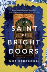 The book cover for “The Saint of Bright Doors” shows an ornate door against a blue background bordered by yellow.