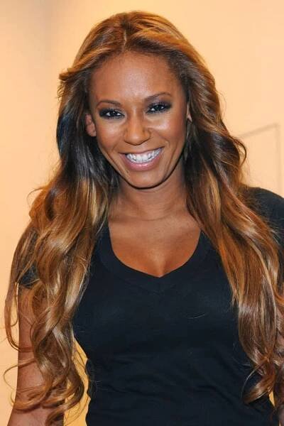 Mel B strikes a pose flaunting her ultra-long waves with a middle parting in Italy, Milan on January 25, 2018.