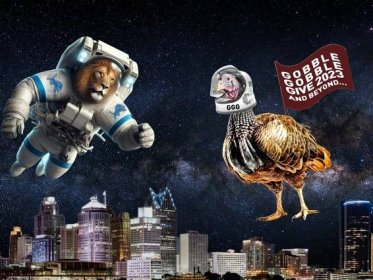Illustration of a lion in a spacesuit with Detroit Lions logos and a turkey in an astronaut helmet reading “GGG” and a flag that says “Gobble Gobble Give 2023 and beyond…” Both float in the stars above the Detroit skyline.