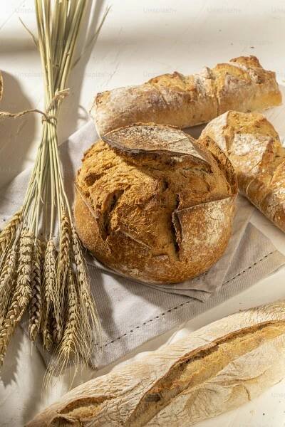a bunch of bread sitting on top of a table