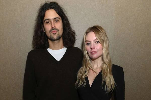 Maximillian King and Nell Hudson attend the Larry King Marylebone Salon Launch