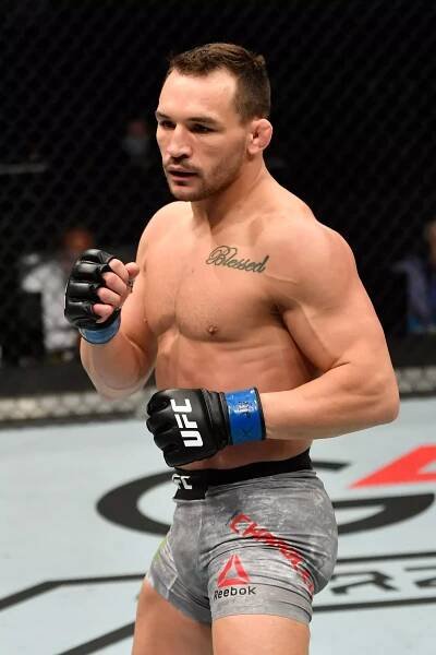 ABU DHABI, UNITED ARAB EMIRATES - JANUARY 24:  Michael Chandler battles Dan Hooker in their lightweight bout during the UFC 257 event inside Etihad Arena on UFC Fight Island on January 24, 2021 in Yas Island, Abu Dhabi, United Arab Emirates. (Photo by Jeff Bottari/Zuffa LLC via Getty Images)