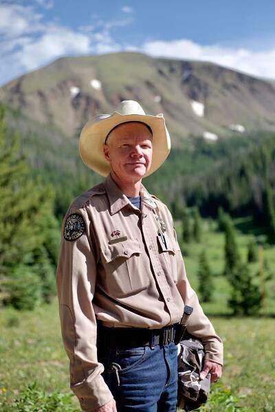 Josh Dilley, a park manager at State Forest State Park, has helped the local community in Walden, Colorado learn to live with the moose that wander near schools and popular park trails. Photograph by Jeremy Miller