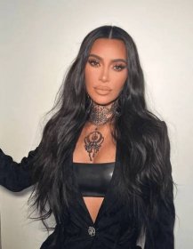 Kim Kardashian with center parted extensions