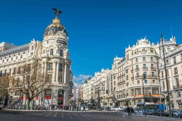 View Of Madrid Street And Buildings Against Blue Sky