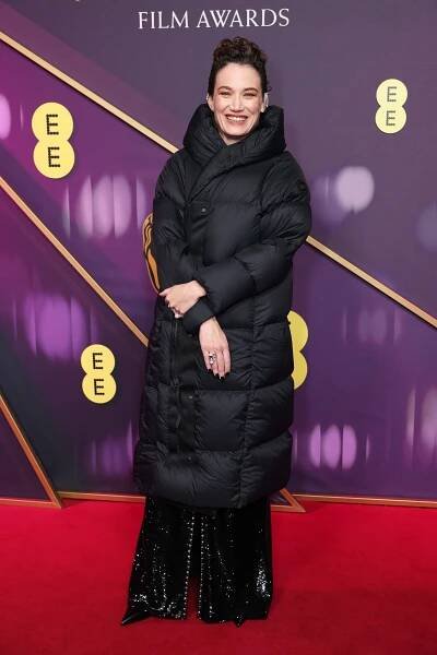 I’m Obsessed With Coralie Fargeat’s Red-Carpet Puffer Coat At The BAFTAs