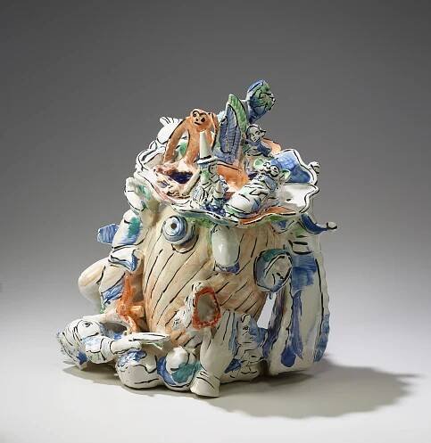 Untitled (Bricolage Head with Monkey and Figurines on Hat), 2000, whiteware and glaze, 22.5 x 21 x 18.5 inches