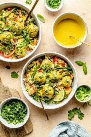 Flavorful jalapeño curry chicken meatballs with gorgeous veggies and a delicious, sweet and savory yellow coconut curry sauce. These protein-packed curry chicken meatball bowls are easy to make for the perfect weeknight meal!