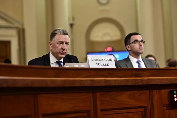 Ambassador Volker, left, makes his opening statement as Morrison, right, listens.
