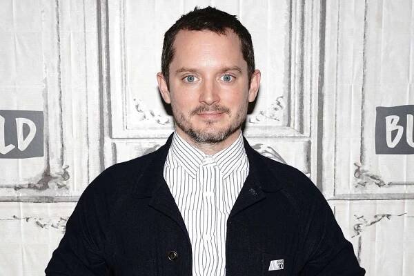 Elijah Wood blasts AMC Theatres' new seat ticket pricing, says it will 'penalize people for lower income'