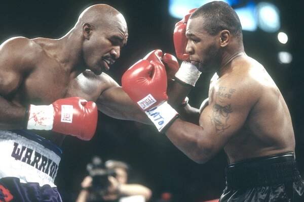 Evander Holyfield and Mike Tyson in their 1997 fight.
