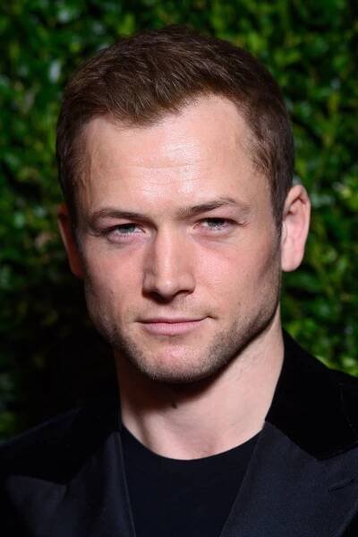 Headshot Of Taron Egerton